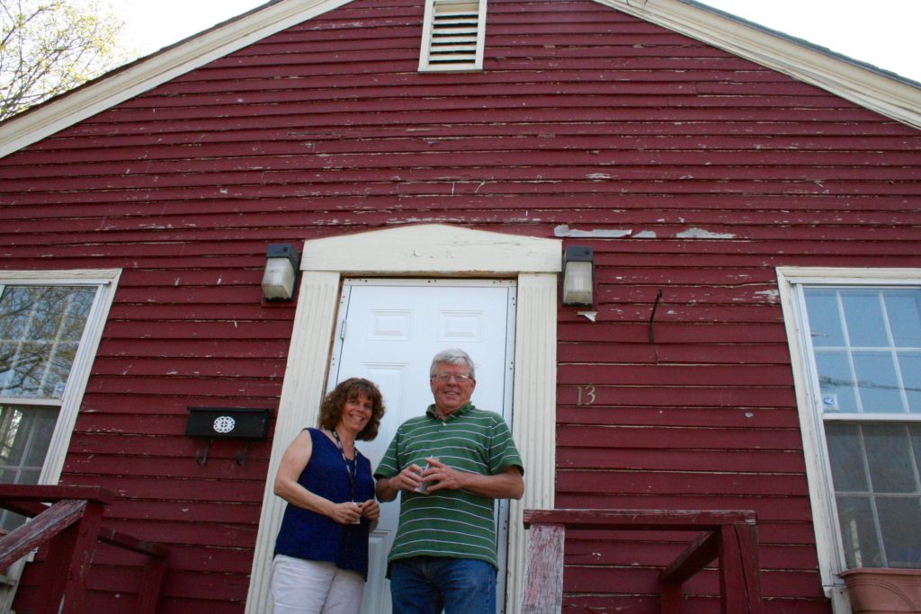 Brittney Sampson, left, and John Bernier from the Cornelia Warren Community Association stand in front of what will be the Frenchtown community hub at 13 Revere St. in Westbrook, following extensive renovations to its interior. Sampson will coordinate the resident-led community-building program, part of an effort to boost the neighborhood's sense of community. The project will receive nearly $39,000 from the Cornelia Warren Association.  