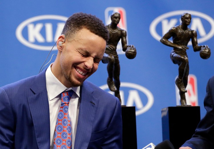 Golden State Warriors guard Stephen Curry smiles as he conducts interviews after receiving his second NBA MVP award Tuesday.   The Associated Press