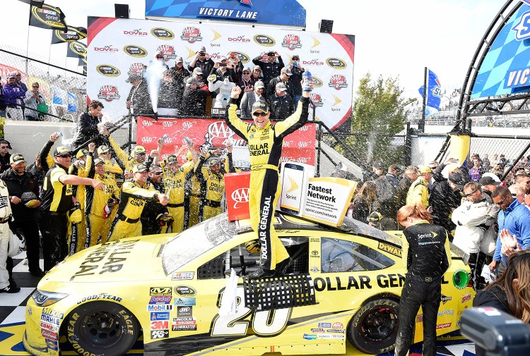 Matt Kenseth celebrates in Victory Lane after he won the NASCAR Sprint Cup series auto race, Sunday, May 15, 2016, at Dover International Speedway in Dover, Del. The Associated Press