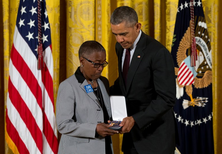 President Obama presents Constance Wilson, grandmother of fallen Philadelphia police Sgt. Robert Wilson III, with his Medal of Valor.