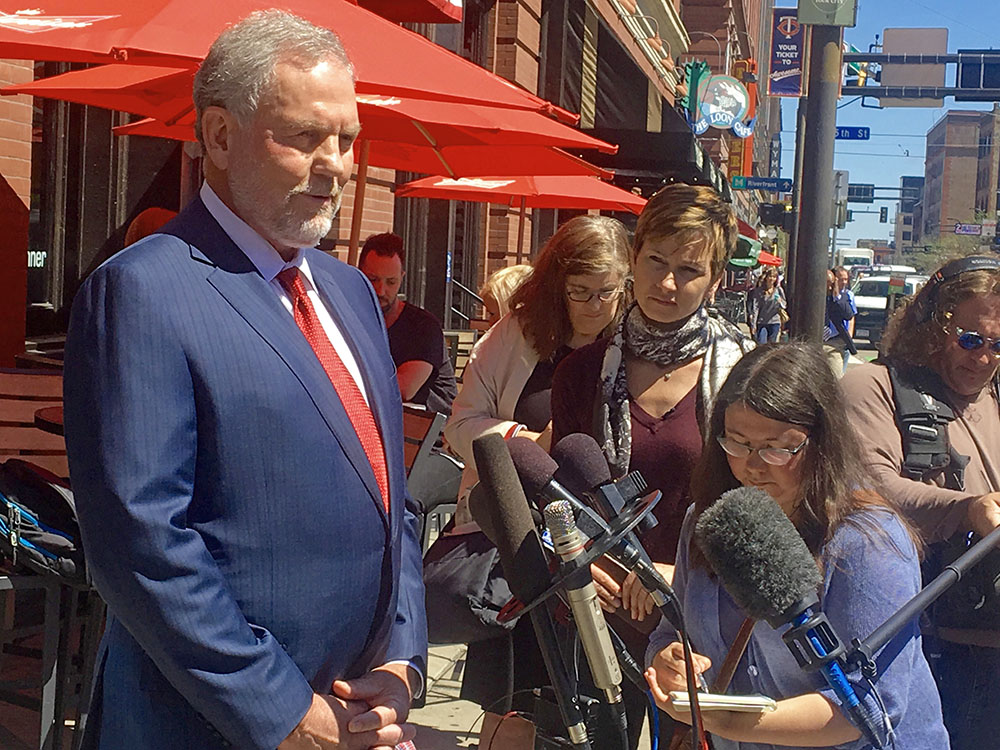 Attorney William Mauzy answers questions from the media as he arrives at his Minneapolis office Wednesday. Mauzy represents California Dr. Howard Kornfeld who couldn't immediately meet Prince so he sent his son Andrew to discuss treatment. The singer died on April 21 at the age of 57.  The Associated Press
