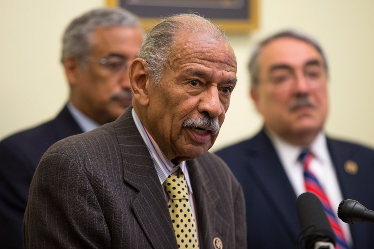 Rep. John Conyers, D-Mich., center, flanked by Rep. Bobby Scott, D-Va., left, and Rep. G.K.  Butterfield, D-N.C., speaks at a news conference Tuesday on Capitol Hill. Conyers and Scott were among the lawmakers who requested the report by the Government Accountability Office, which found deepening segregation of black and Hispanic students nationwide.