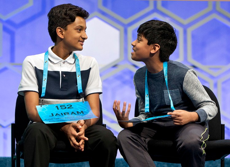 Nihar Janga, 11, , right, talks with Jairam Hathwar, 13, left, after another round where the two went head to head in a drawn out battle that ended in them being named co-champions.