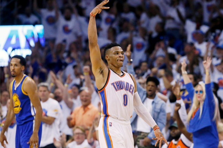 Oklahoma City guard Russell Westbrook  celebrates a three-pointer during the Thunder's win over Golden State in Game 4 on Tuesday.   The Associated Press