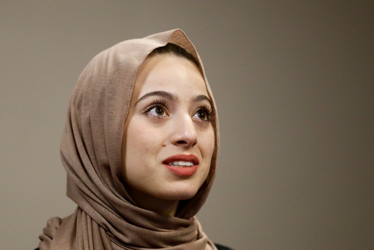 Bayan Zehlif, 17, speaks during a news conference on Monday  in Anaheim, Calif. Zehlif says she is "extremely saddened, disgusted, hurt and embarrassed" by the photo of her in the Los Osos High School yearbook identifying her as "Isis Phillips." She says the school told her it was a "typo" but she says, "I beg to differ." The Associated Press