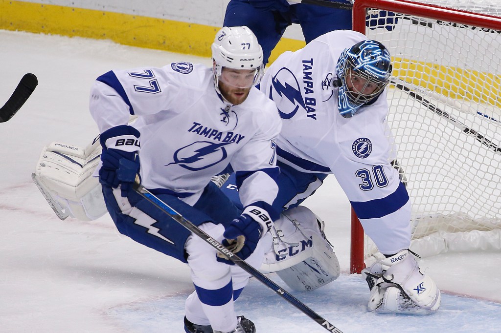 Tampa Bay Lightning goalie Ben Bishop (30) twists his leg as he is injured during the first period of Game 1 against the Pittsburgh Penguins in the Stanley Cup Eastern Conference finals Friday in Pittsburgh.
The Associated Press