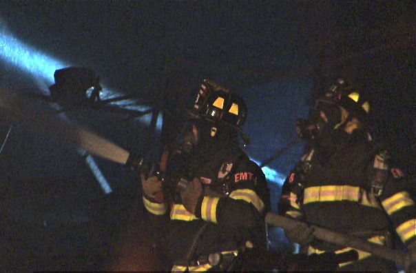 Firefighters work at the scene of the blaze in Windham Tuesday night. Courtesy WCSH