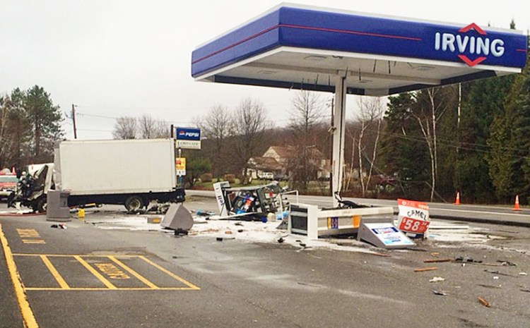 A box truck veered off Route 3 in Liberty Tuesday morning, crashing into utility poles and fuel pumps at a Circle K store/ Irving station. Contributed photo