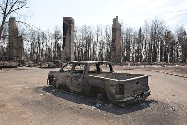 Wildfires devastated this neighborhood of Fort McMurray, Canada. The fire destroyed more than 2,400 structures in the city, although firefighters managed to save the hospital, water treatment plant and the airport. Crews continued to battle hot spots on the edge of the city on Monday while fires raged out of control deeper in the forest. Reuters