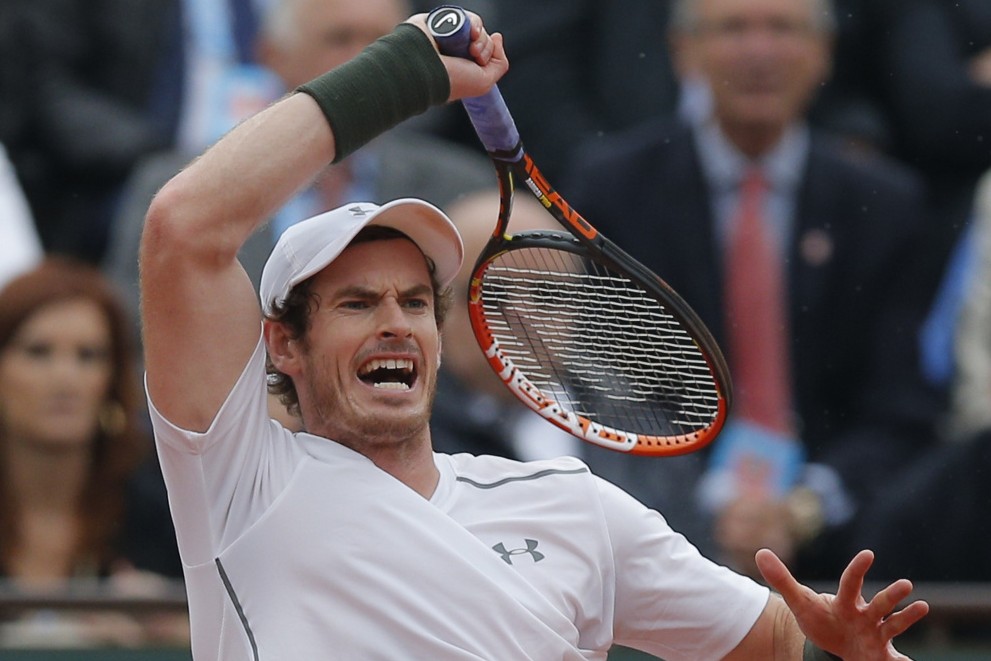 Andy Murray returns the ball to Richard Gasquet of France during their quarterfinal match Wednesday at the French Open. Murray recovered from losing the first set and will take on Stan Wawrinka, the defending champion, in the semifinals.