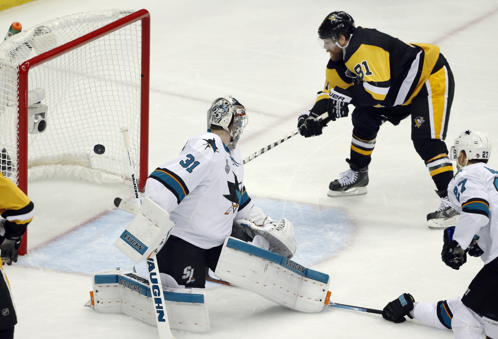 Phil Kessel of the Penguins scores a goal behind San Jose Sharks goalie Martin Jones in the second period in Game 2 of the Stanley Cup Final on Wednesday in Pittsburgh.