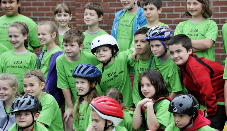 Third-graders gather for a group photo before they head out on the Henry L. Cottrell School’s annual bike ride to a beach in Monmouth in late May. 


Shawn Patrick Ouellette/
Staff Photographer
