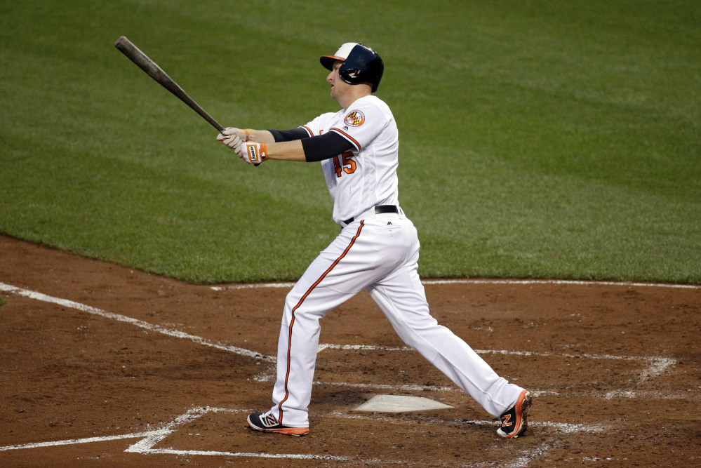 The Orioles' Mark Trumbo watches his two-run home run in the fourth inning, his first of two home runs in the game.