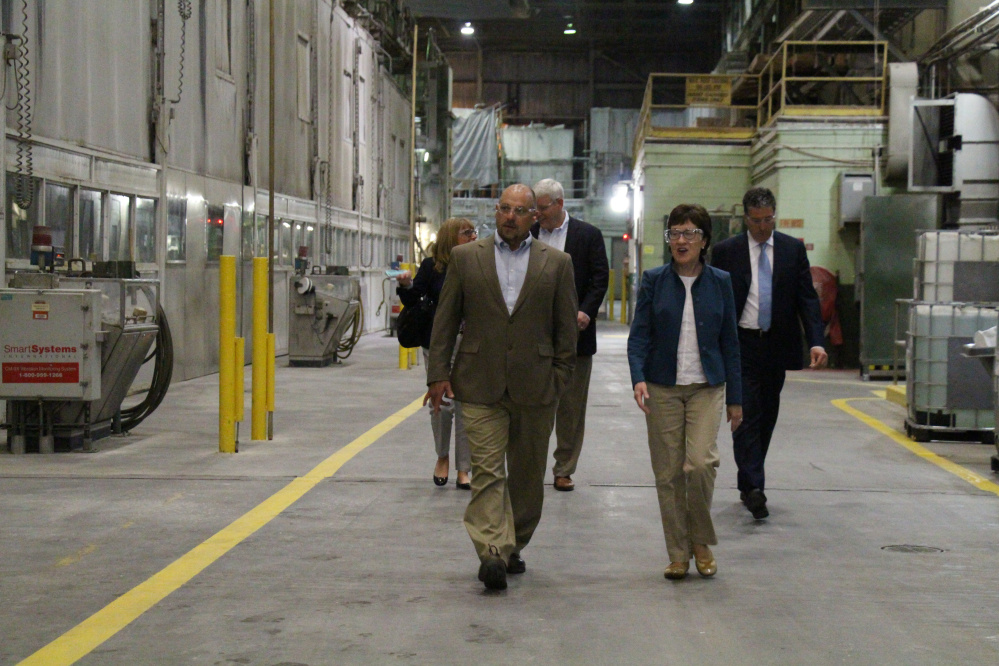 U.S. Sen. Susan Collins tours the Catalyst Paper mill in Rumford on Thursday accompanied by Randy Chicoine, vice president and general manager of the mill. Collins and Sen. Angus King have asked the U.S. Department of Commerce to expedite a review of new countervailing duties that were imposed on all Canadian papermakers, regardlessof whether they received subsidies from the Canadian government, a policy that has hurt British Columbia-based Catalyst. The Rumford mill, which employs 640, recently restarted a paper machine to produce a new line of paper. 
Courtesy of Catalyst Paper