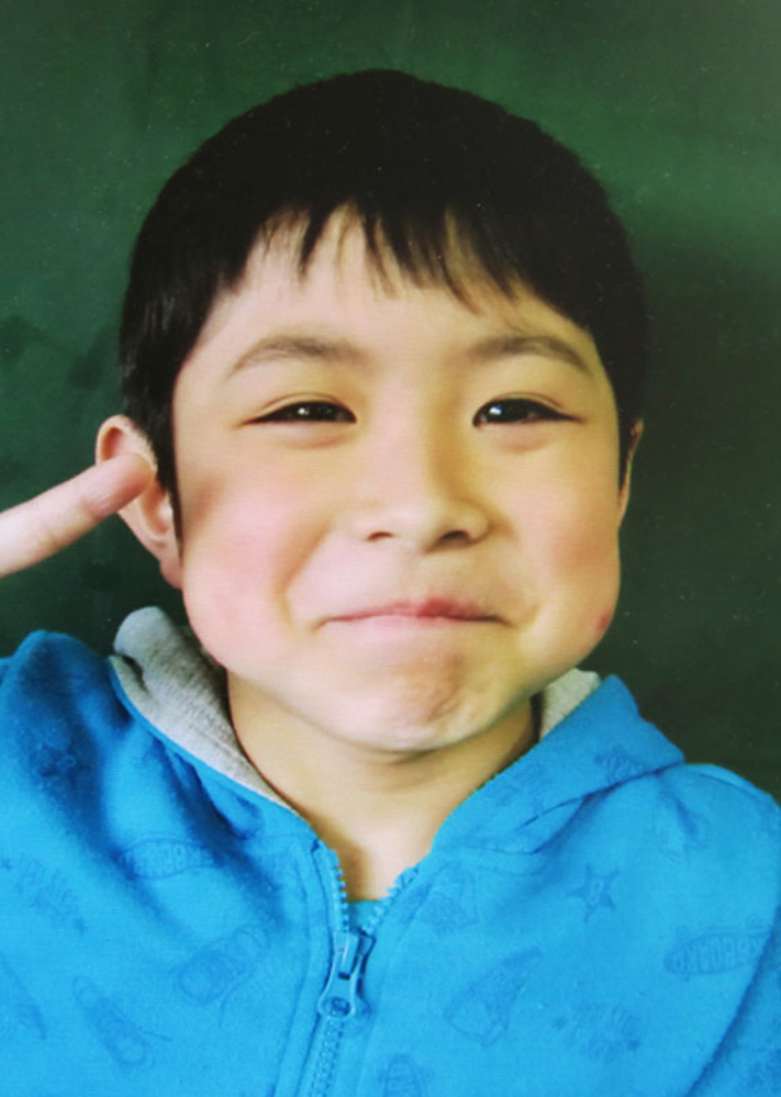 Seven-year-old Yamato Tanooka was found safe nearly a week after he was abandoned in the forest by his parents in Nanae, Hokkaido, northern Japan. This photo was taken by his school before he went missing.
