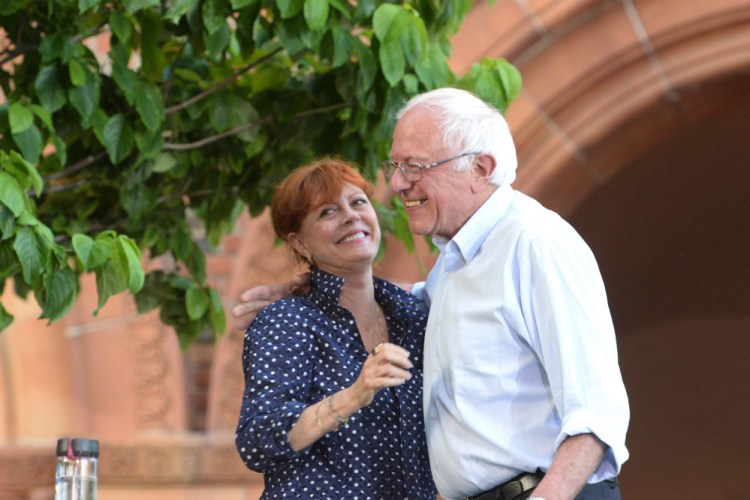 Democratic presidential candidate Sen. Bernie Sanders, I-Vt., is joined by actress Susan Sarandon as he speaks to a large crowd gathered on the California State University Chico campus during a campaign rally stop on Thursday.