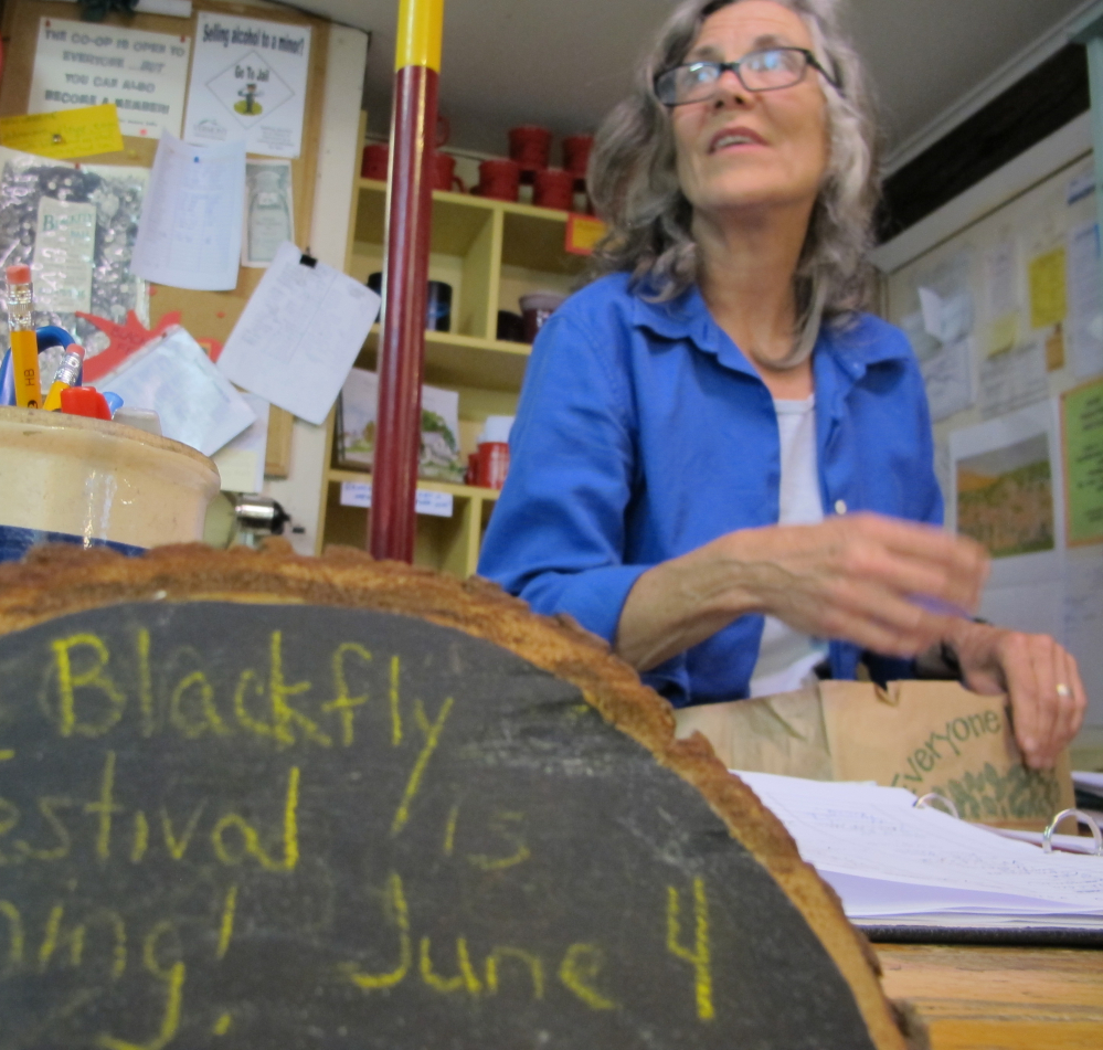 Jennifer Zollner, a clerk at the Adamant Co-op., hopes the blackflies won't overstay their welcome, but looks forward to the 13th annual Adamant Blackfly Festival.