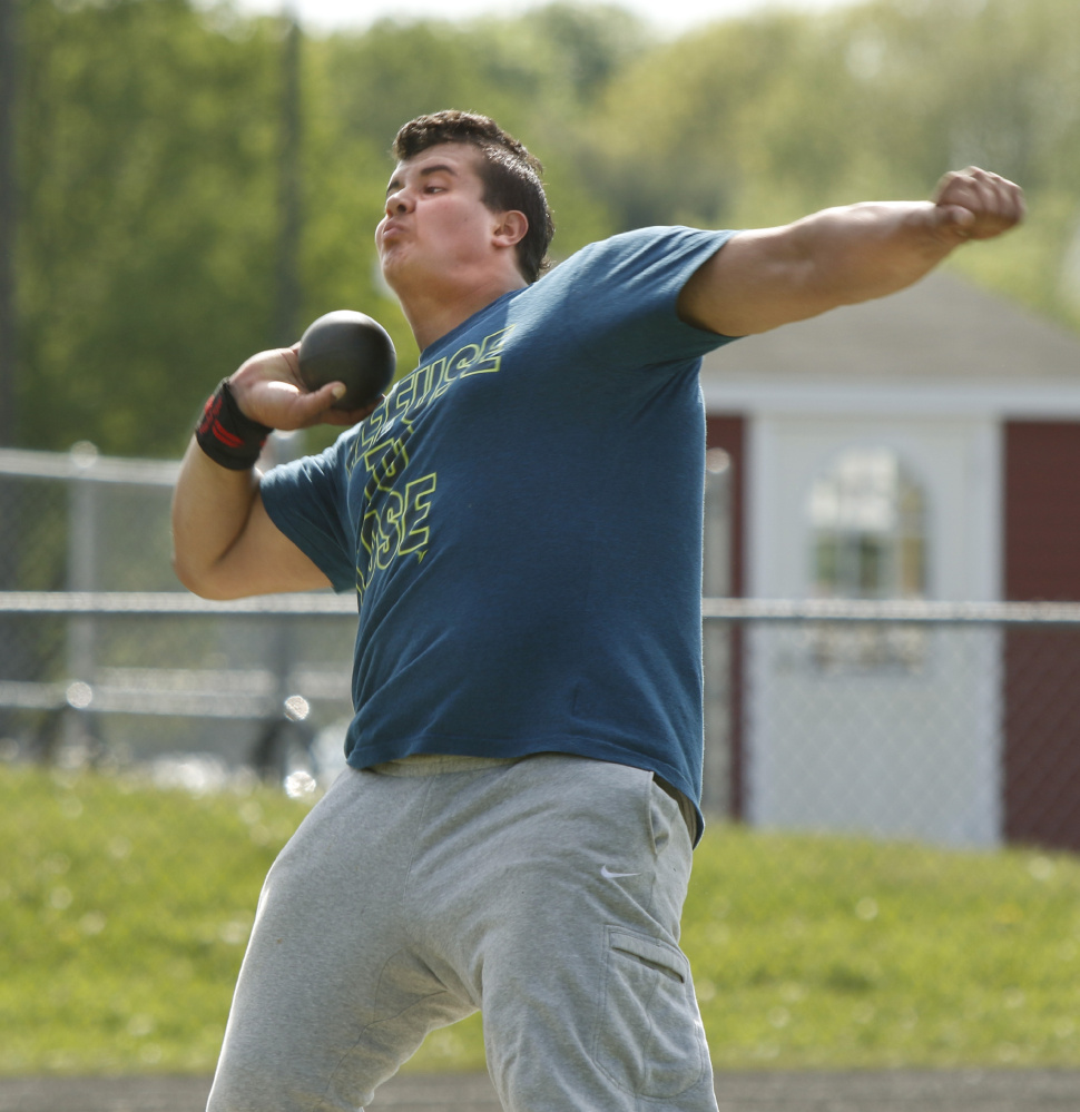 Shot putter Dan Guiliani practices for the event at South Portland High School.