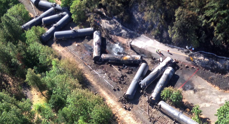 An aerial view provided by the Washington State Department of Ecology shows scattered tank cars Saturday following a derailment near Mosier, Ore., Friday.
