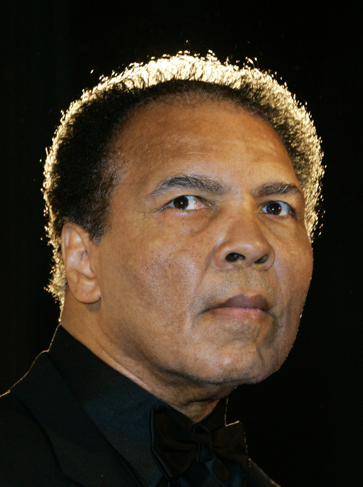 In this Dec. 17, 2005, file photo, boxing legend Muhammad Ali poses in Berlin, Germany.