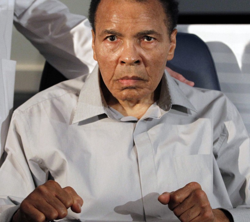 Muhammad Ali displays his signature boxing pose in 2012 at a ceremony in Phoenix, Arizona. He began showing signs of Parkinson's syndrome shortly after he retired in 1981.