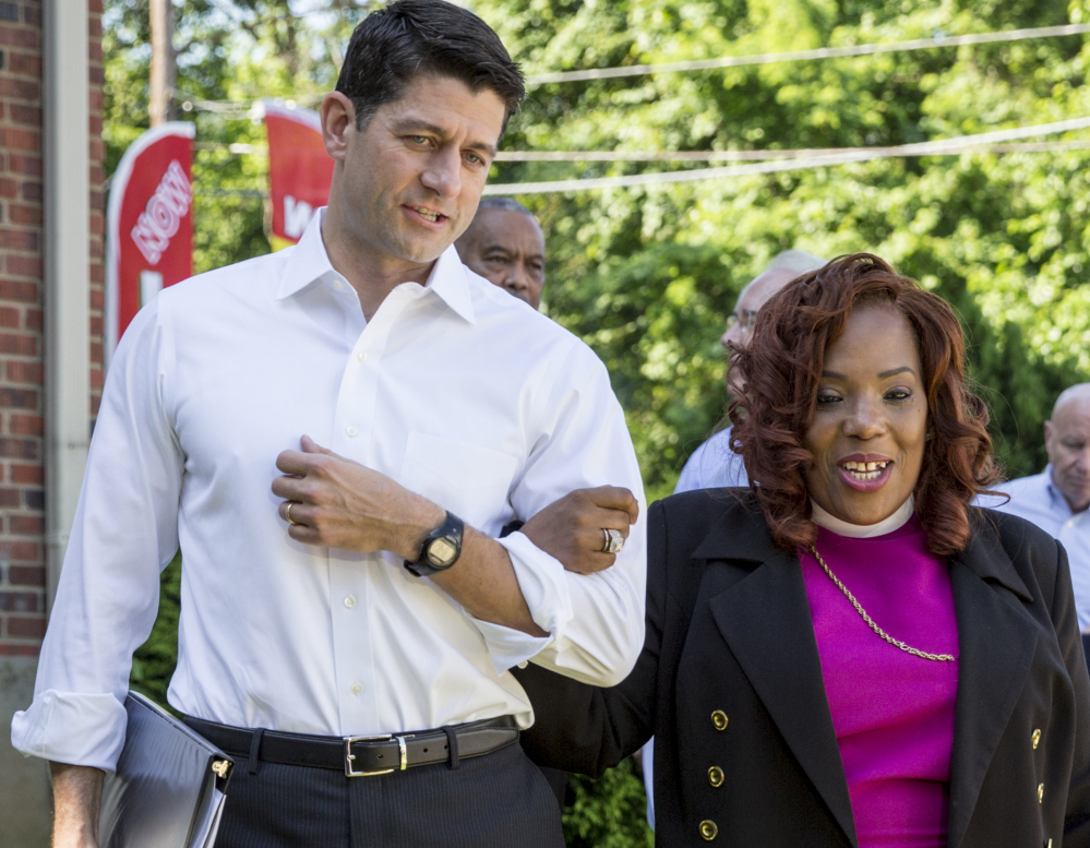 House Speaker Paul Ryan walks with Bishop Shirley Holloway, director of the House of Help City of Hope in Anacostia, one of Washington's poorest areas, on Tuesday.
.Associated Press/ J. Scott Applewhite
