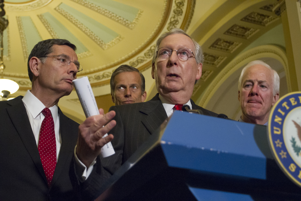 Senate Majority Leader Mitch McConnell of Ky., center, joined by fellow Sens. John Barrasso, left, John Thune and John Cornyn, calls on Trump Tuesday to "get on message."