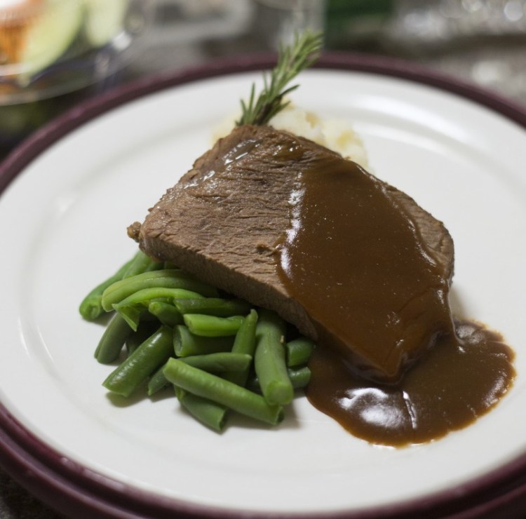 Pot roast with gravy, green beans and mashed potatoes and Central Maine Medical Center in Lewiston.