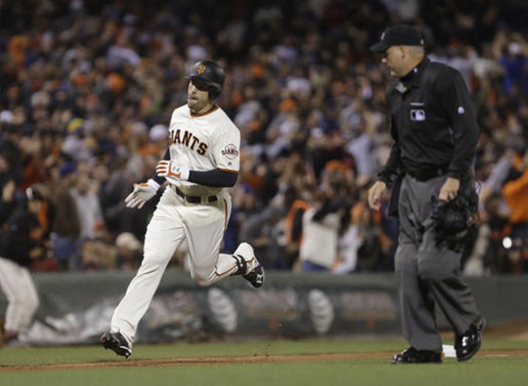 Mac Williamson of the Giants runs the bases after hitting the winning home run Wednesday night off of Boston's David Price in the eighth inning at San Francisco.