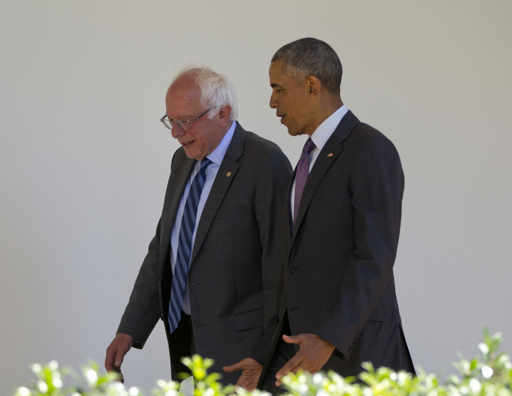 President Barack Obama walks with Democratic presidential candidate Sen. Bernie Sanders, I-Vt., along the Colonnade of the White House in Washington on Thursday.