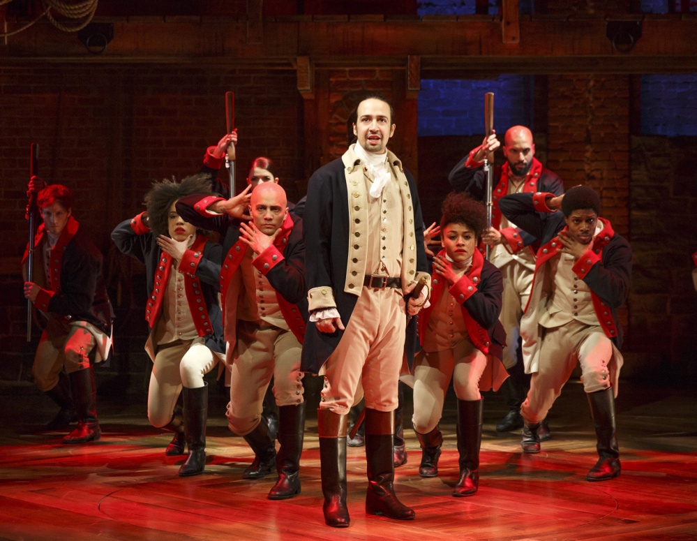 Lin-Manuel Miranda with the cast of "Hamilton" during a performance in New York.