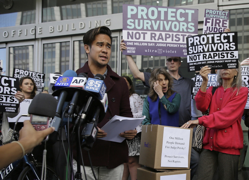 Sexual assault victim Chris Huqueriza speaks at a rally Friday in San Francisco before more than 800,000 signatures were delivered to the Commission on Judicial Performance in a symbolic call for the removal of Judge Aaron Persky from the bench.