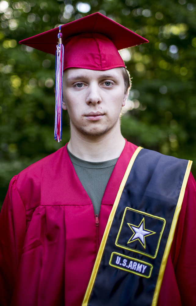 Greg Woodworth, 19, a senior at Mount Ararat High School, wears his Army sash Friday at his home in Topsham. He wouldn't be allowed to wear it at the school's graduation, so he plans to have his own ceremony at the American Legion post in town.