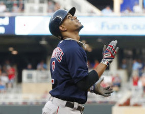 Boston's Xander Bogaerts looks skyward as he heads home after hitting a three-run home run off Twins pitcher Tyler Duffey in the fifth inning Friday night in Minneapolis.