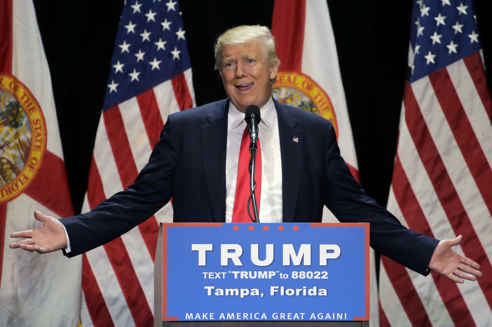 Donald Trump seeks the embrace of Florida voters during a Saturday rally in Tampa, Fla., where he warned that disunity could cost Republicans congressional control.