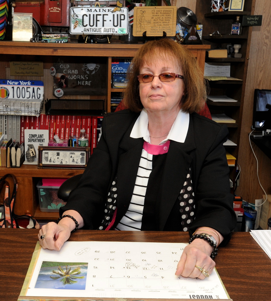 Former Anson tax collector Claudia Viles, shown at her desk in 2015, is scheduled to go on trial June 20 over allegations that she stole more than $438,000 from the town office. Jury selection begins Wednesday.