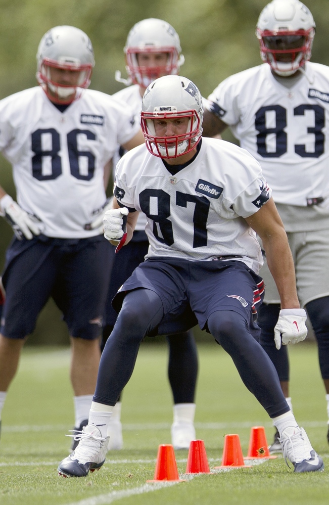 Back on the field for the first time in this minicamp, tight end Rob Gronkowski is all business as he runs a drill during Monday's practice in Foxborough.
