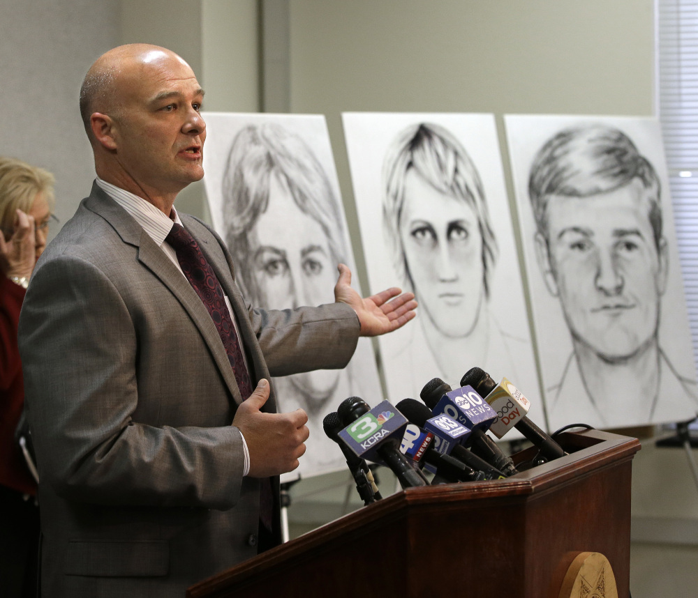 Sgt. Paul Belli of the Sacramento County Sheriff's Department shows law enforcement drawings of a suspected serial killer who terrorized California in the 1970s and 1980s.
at a news conference Wednesday, June 15, 2016, in Sacramento, Calif. Authorities announced a $50,000 reward for the arrest and conviction of the person that along with murder, is suspected of committing at least 45 rapes and dozens of burglaries. (AP Photo/Rich Pedroncelli)