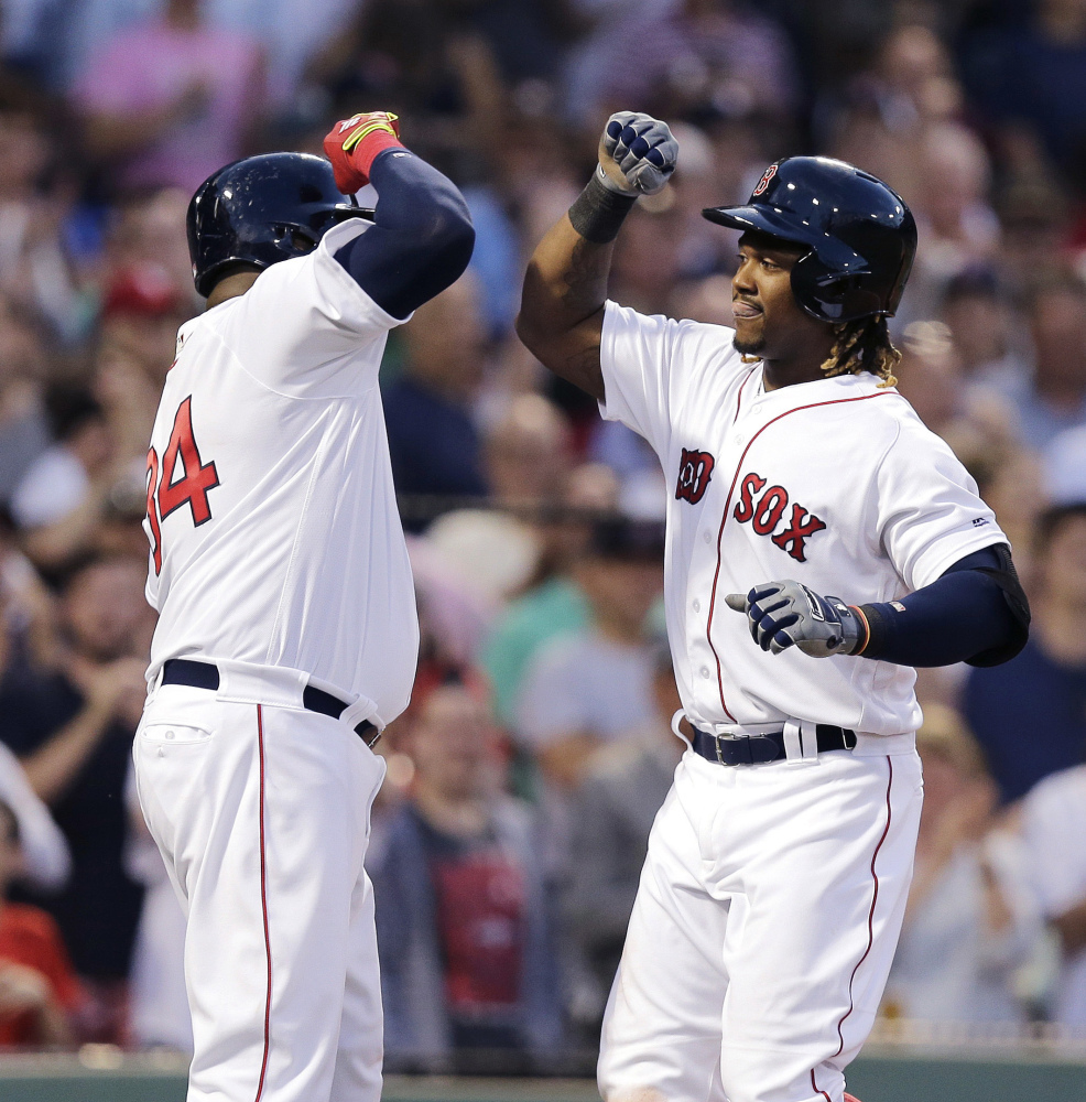 Boston's Hanley Ramirez, right, is congratulated by David Ortiz after his three-run home run in the third inning Wednesday night against the Baltimore Orioles at Fenway Park.