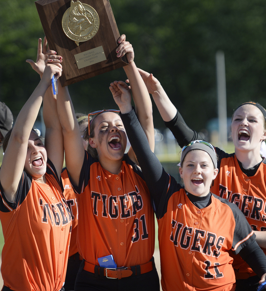 Biddeford players, from left, Erin Martin, Jocelyn Moody, Cassie Gonneville
and Charlotte White celebrate winning the Class A South title on Tuesday. Next up: Saturday's state championship clash with Skowhegan.