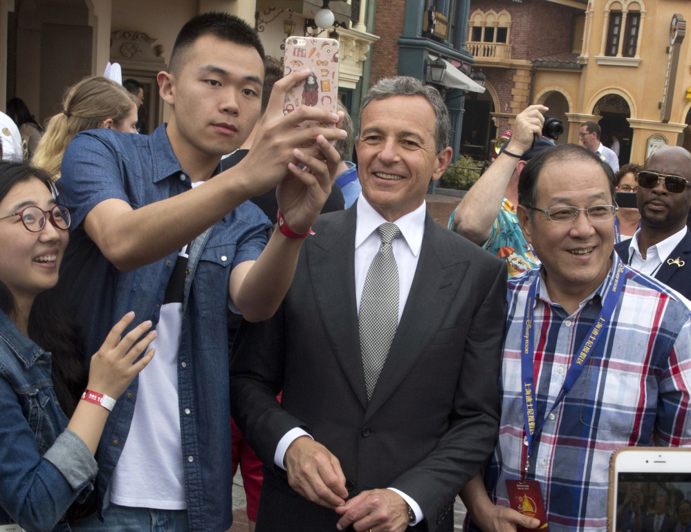 Disney CEO Bob Iger, center, called the opening of Shanghai Disneyland one of his company's 'proudest' moments.