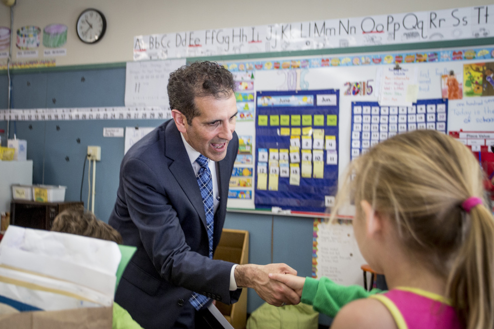 Xavier Botana, the new superintendent of Portland schools, greets students as he tours Hall Elementary School on Thursday.