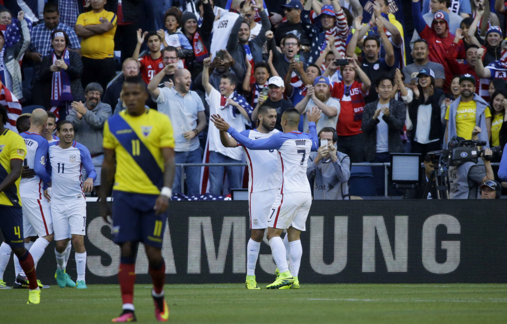 Clint Dempsey, center, of the United States celebrates with teammate Bobby Wood, right, after scoring his side's first goal against Ecuador during a Copa America Centenario quarterfinal soccer match on Thursday.