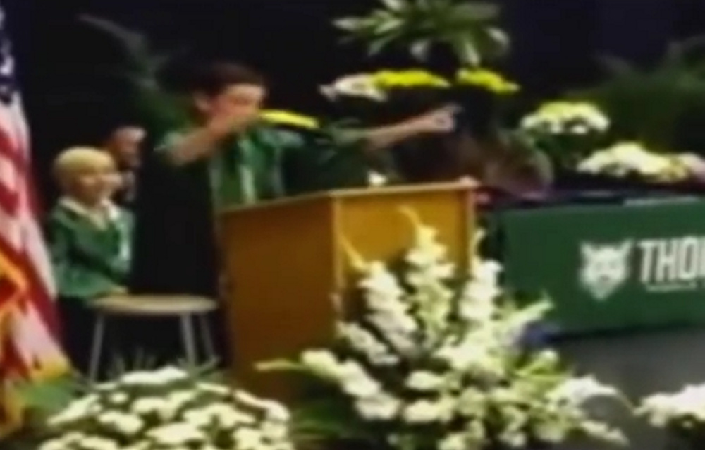 Jack Aiello entertains the audience at his 8th-grade graduation in Arlington Heights, Illinois, with his impersonations of politicians.