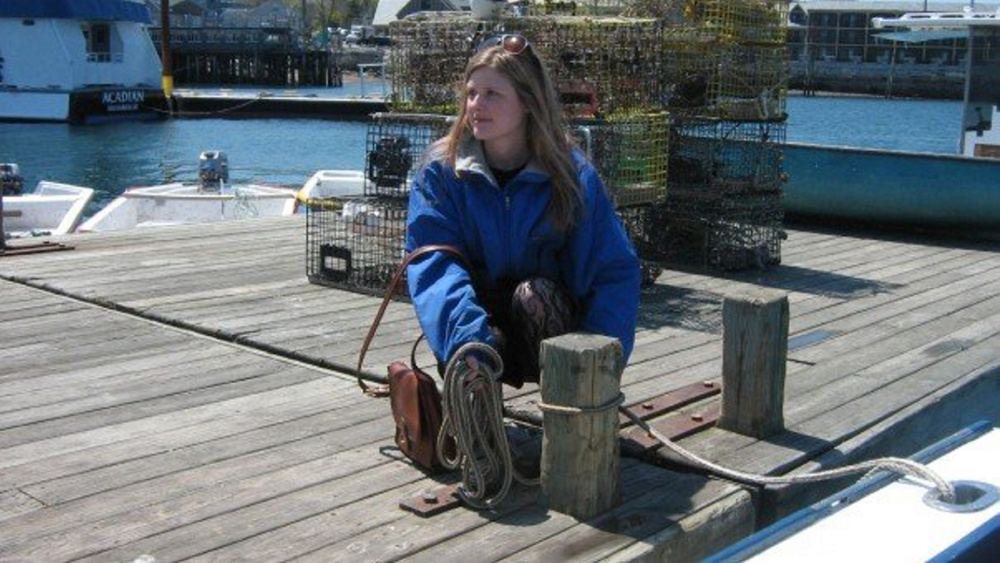 Anna Noyes on a dock in Bar Harbor.
