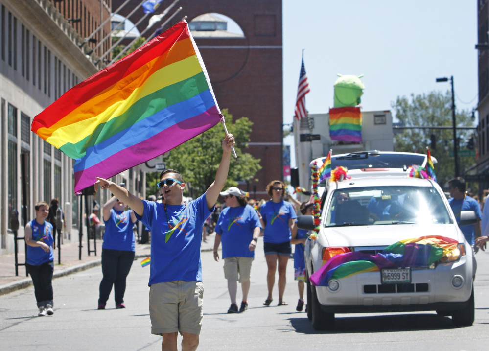 The Pride Portland parade marches down High Street on Saturday in Portland.