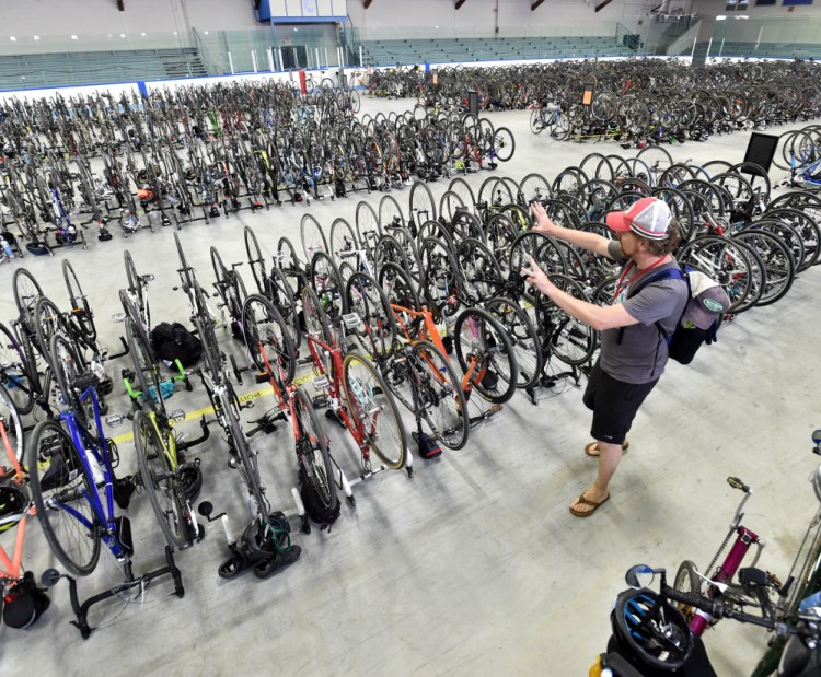 A Trek Across Maine rider stashes his bicycle in Alfond Arena at Colby College after a day of riding from Farmington to Waterville in the 2016 event.
