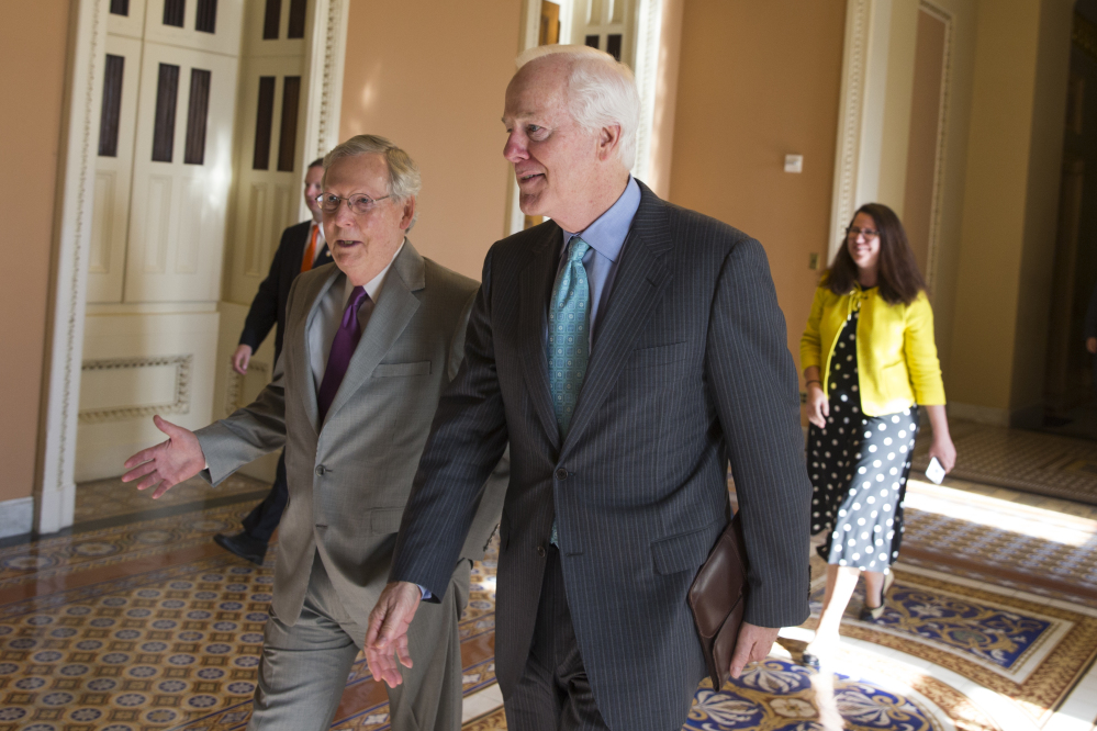Senate Majority Leader Sen. Mitch McConnell, R-Ky., left, and Sen. John Cornyn, R-Texas, arrive for a vote on Capitol Hill Monday.