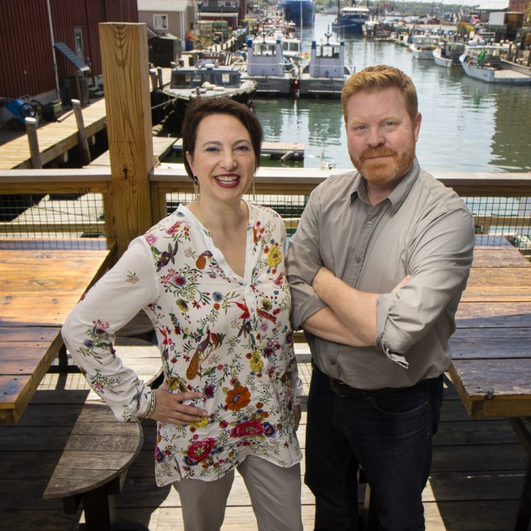 Gillian and Jim Britt, on Portland's waterfront outside one of their clients' businesses, do public relations work for several restaurants and food events.