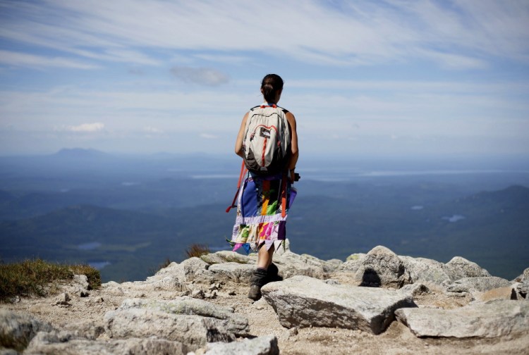 Sarah Morse of North Berwick takes in the view near the summit of Mount Katahdin, the northern terminus of the Appalachian Trail. The number of thru-hikers at Baxter has soared in the past couple of decades, from 359 in 1991 to 2,137 in 2015.